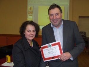 Monica O'Brien receiving her Preliminary Cert from Eamonn Magee, President of FIBKA Monica O'Brien receiving her Preliminary Cert from Eamonn Magee, President of FIBKA
